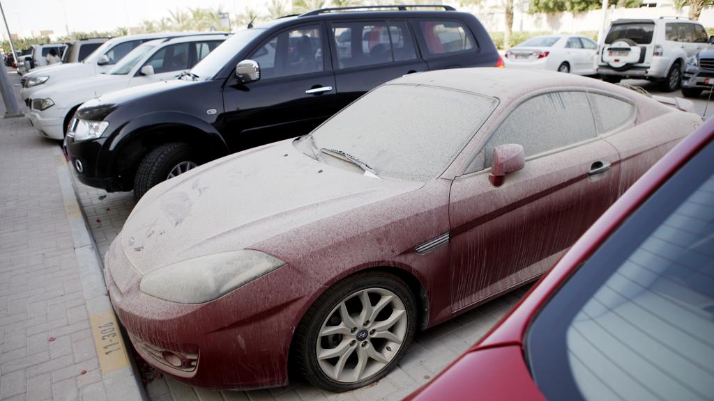 A photo showing a dirty car